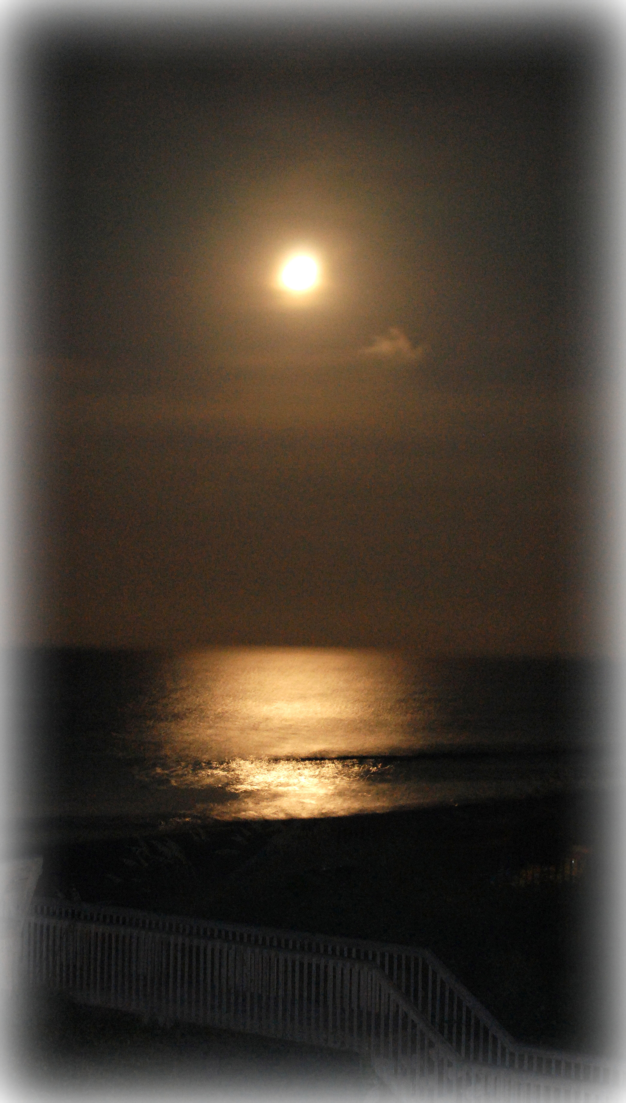 Moon rising over the ocean